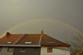 Beautiful rainbow and ordinary roofs