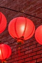 Beautiful round red lantern hanging on old traditional street, concept of Chinese lunar new year festival, close up. The undering Royalty Free Stock Photo