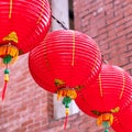 Beautiful round red lantern hanging on old traditional street, concept of Chinese lunar new year festival, close up. The undering Royalty Free Stock Photo