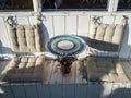 Beautiful round table with soft cushions for a seat in a street cafe Russia in Sochi Royalty Free Stock Photo