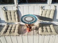 Beautiful round table with soft cushions for a seat in a street cafe in Sochi 09.05.2019 Royalty Free Stock Photo