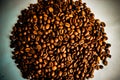 Beautiful round texture of freshly roasted selected delicious rich brown natural fragrant coffee tree grains, Arabica coffee beans Royalty Free Stock Photo