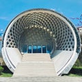 Beautiful round unusual modern futuristic abstract white porch with a staircase, the entrance to the building, the house