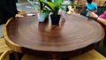 Beautiful round wooden dinner table displaysed in shopping mall