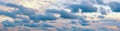 Beautiful row of blue clouds against sky at sunset. Cumulus clouds