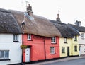 Beautiful row of colorfu thatched cottages in Hatherleigh, Devon, UK.