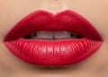 Beautiful ruby red lipstick on perfect lips. Royalty Free Stock Photo