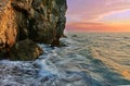 Rocky Cliffs and Waves During Sunset