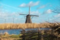 Beautiful rural landscape, fence, field, windmill Dutch windmill.