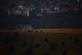 Beautiful rural landscape with horse riders in the field at sunset Royalty Free Stock Photo