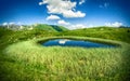 Beautiful rural landscape with a lake and sky reflected Royalty Free Stock Photo