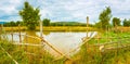 Beautiful rural landscape, pond on the foreground. Laos. Panorama