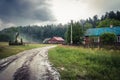 Beautiful rural landscape for a while after the storm has passed. Moody atmosphere of the Polish countryside. Country houses, a Royalty Free Stock Photo