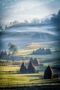 Beautiful rural mountain landscape in the sunrise light with morning fog Royalty Free Stock Photo