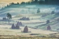 Beautiful rural mountain landscape in the sunrise light with morning fog Royalty Free Stock Photo