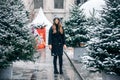 Beautiful russian girl in a cloud day in winter walking in Tverskaya Square in Christmas time Royalty Free Stock Photo