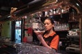 Waitress filling a glass with beer in a bar in Almaty, Kazakhstan