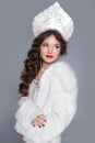 Beautiful Russian girl model in fur coat and exclusive design cl