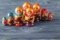 Beautiful Russian matreshka doll on blue wooden background