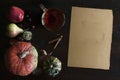 Beautiful rustic fall flat lay with glass of tea, leaves, pumpkins, chestnuts, cup of tea and old paper scroll, on wooden backgrou Royalty Free Stock Photo