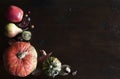 rustic fall flat lay with leaves, pumpkins and chestnuts on wooden background