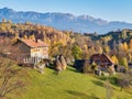 Beautiful rustic landscape in Magura village,Romania, with traditional romanian houses and Piatra Craiului mountains in the Royalty Free Stock Photo
