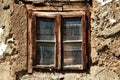 Rustic wood framed window in an old adobe wall Royalty Free Stock Photo