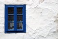 Rustic wood framed window in an old adobe wall Royalty Free Stock Photo