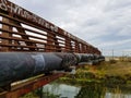 Rusty old bridge over a creek Royalty Free Stock Photo