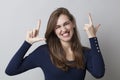 Beautiful 20s girl enjoying a toothy LOL with elegance Royalty Free Stock Photo