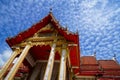 Beautiful sacred red roof main hall ornament of famous buddhist temple with blue sky background, Wat Chalong temple Royalty Free Stock Photo