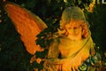 Beautiful sad angel. Vintage styled image of ancient statue. Fragment of sculpture. Horizontal image