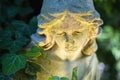 Beautiful sad angel. Vintage styled image of ancient statue. Fragment of sculpture. Selective focus