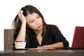 Beautiful sad and depressed Asian Korean businesswoman working in stress at office computer desk feeling overwhelmed and frustrate Royalty Free Stock Photo