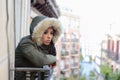 Beautiful sad desperate hispanic woman in winter coat suffering depression Royalty Free Stock Photo