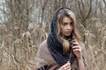 beautiful sad girl is walking in the field. Photo in brown tones. Royalty Free Stock Photo