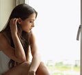 Beautiful sad lonely woman in profile view thinking about and lo Royalty Free Stock Photo
