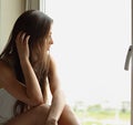 Beautiful sad lonely woman in profile view thinking about and lo Royalty Free Stock Photo