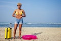 Beautiful sad and sick african american woman in yellow swimsuit and denim shorts holding hands on stomach and feeling Royalty Free Stock Photo