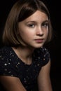 Beautiful sad teen girl, black background Royalty Free Stock Photo