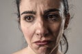 Beautiful and sad woman crying desperate and depressed with tears on her eyes suffering pain Royalty Free Stock Photo