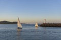 Beautiful sailboat and Howth Lighthouse