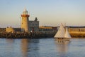 Beautiful sailboat and Howth Lighthouse