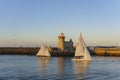 Beautiful sailboat and Howth Lighthouse