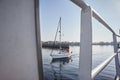 A beautiful sailing boat with sailors, sailing on calm water in the sun