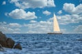 Beautiful sailing boat on the sea, blue sky with cirrocumulus clouds, Costa Brava, Catalonia, Spain Royalty Free Stock Photo