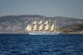 Beautiful sailing ship in the sea on a background of mountains