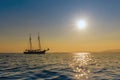 Beautiful sailing yacht on the horizon at sunset