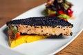 Salmon fillet with sesame close-up on a plate. Royalty Free Stock Photo