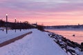 Beautiful Samuel-De Champlain walkway along the St. Lawrence River seen during a colourful winter dawn